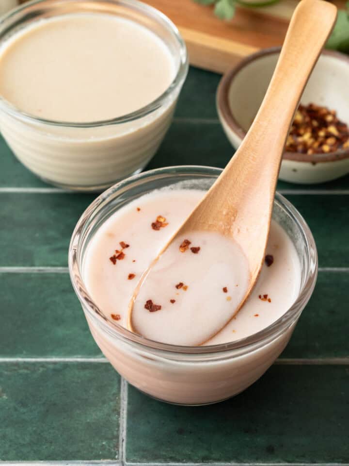 Two versions of ume plum vinegar dressing in small glass bowls.
