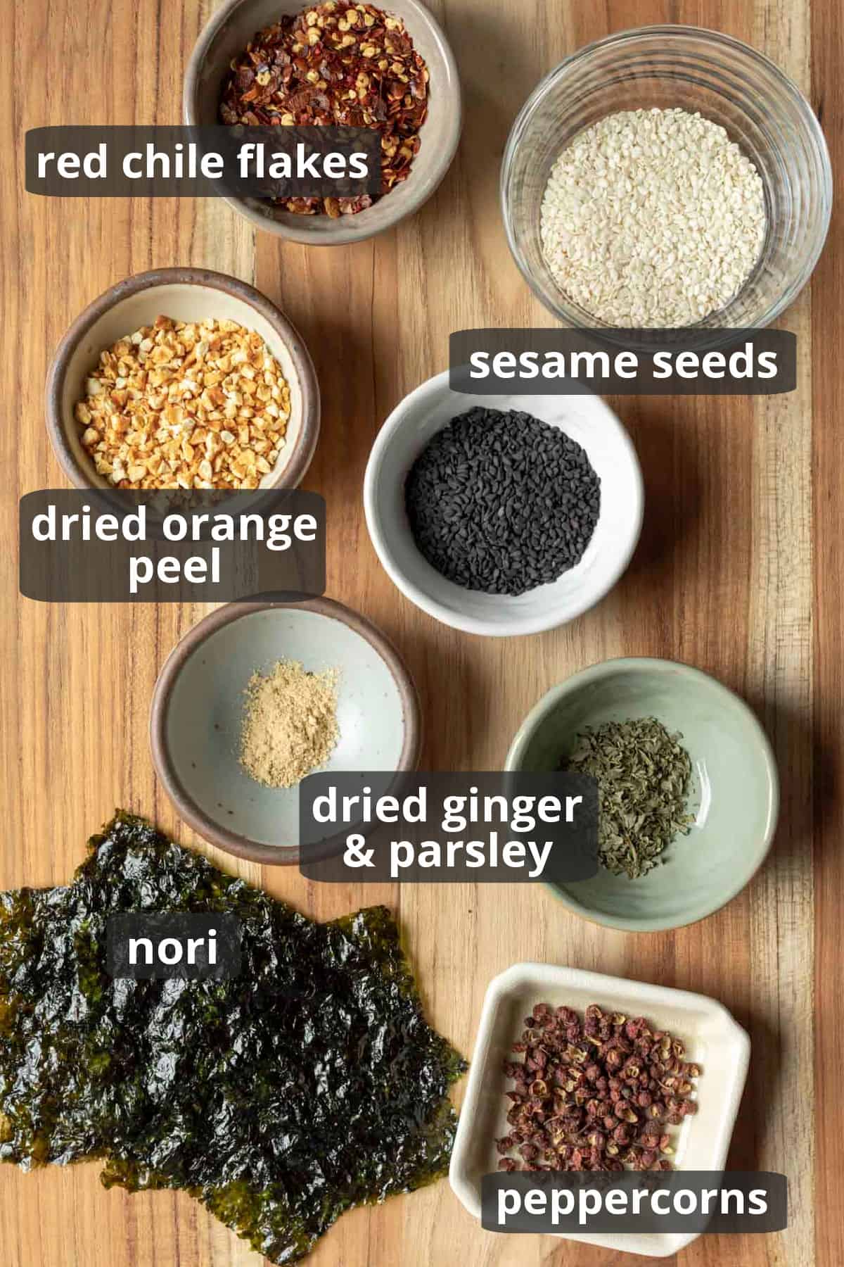 Labeled photo of the ingredients needed for homemade shichimi togarashi.