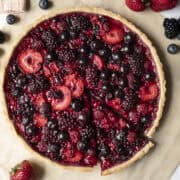 Overhead view of baked mixed berry tart in a gluten-free vegan crust.