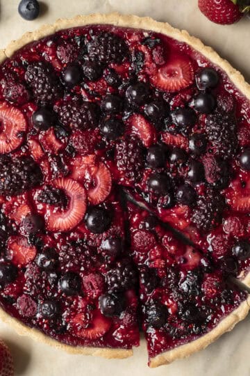 Overhead view of baked mixed berry tart in a gluten-free vegan crust.