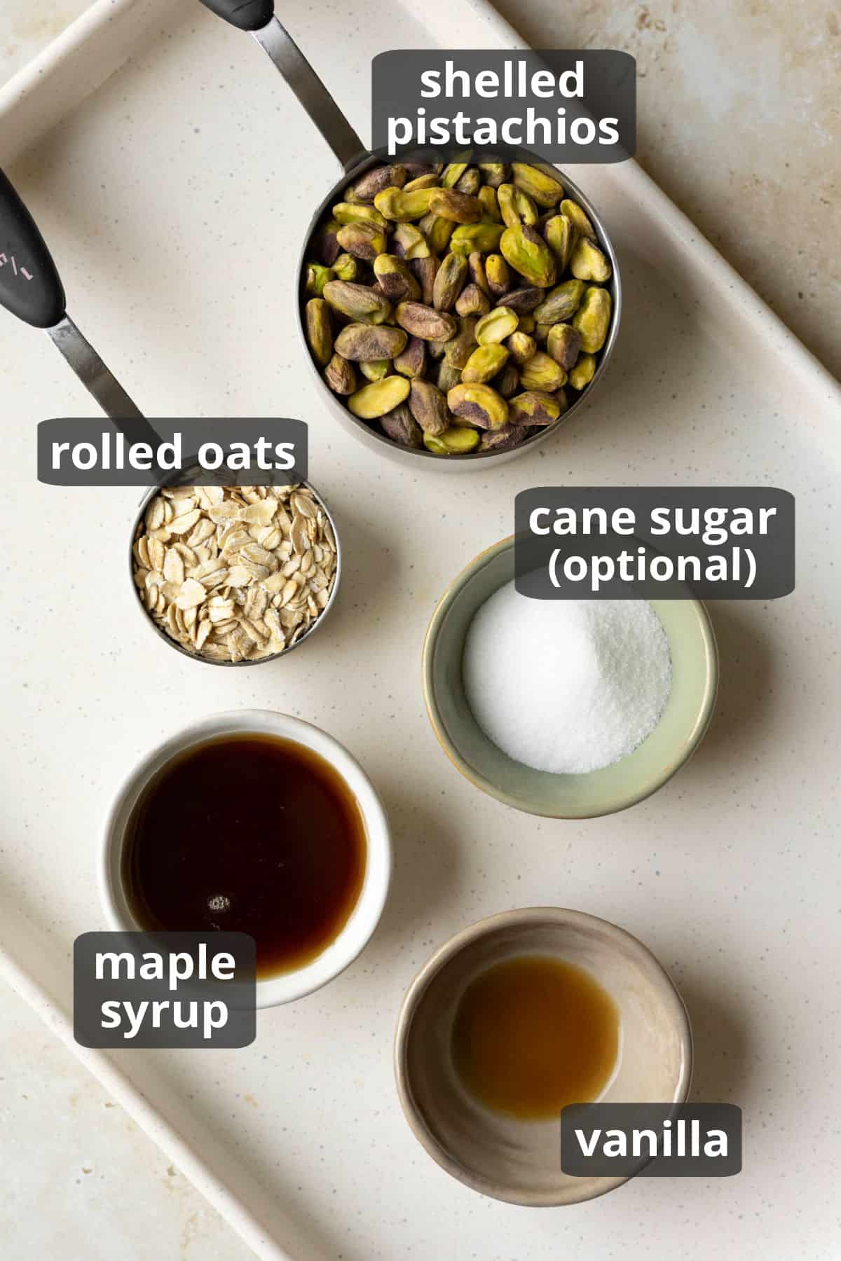 Labeled photo of the 5 ingredients needed to make the flourless vegan pistachio cookies.