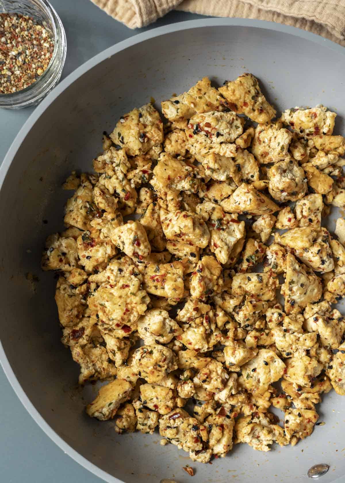 A pan of tofu scramble seasoned with Japanese shichimi togarashi blend.