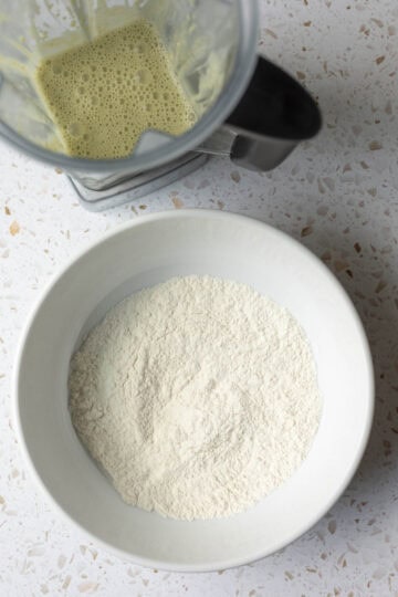 Pistachio milk in blender and dry ingredients in a large mixing bowl.