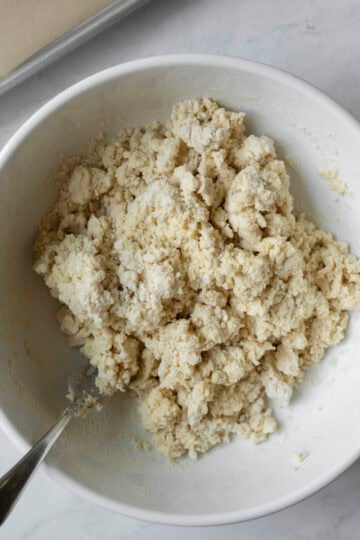 A shaggy biscuit dough ready to be pressed out and cut.