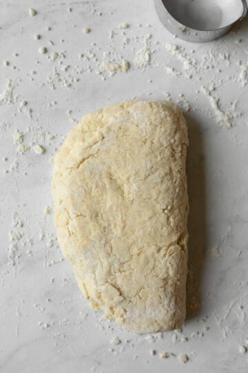 Folding the dough to create flaky layers.
