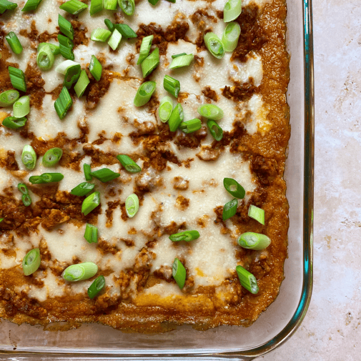 Overhead view of a cheesy plant-based polenta casserole.