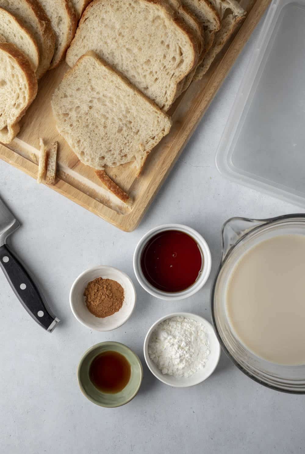 Overhead view of bread and the eggless batter ingredients mise en place.