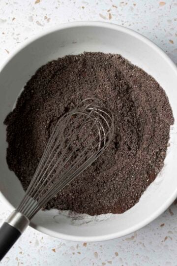 Whisking together the dry ingredients in a large mixing bowl.