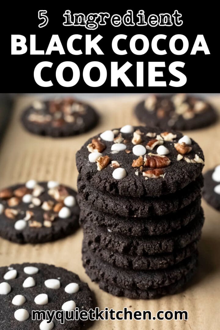 A stack of black cocoa cookies with recipe title to save on Pinterest.