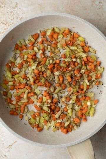 Thyme, sage, garlic, and black pepper added to the mirepoix.