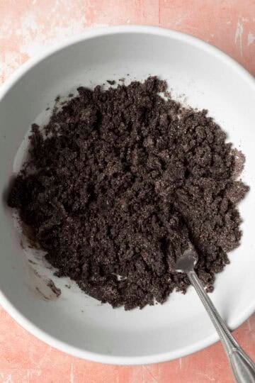 Mixing wet ingredients into the black cocoa dirt.