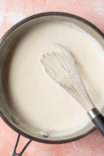 Heating the pudding on the stove until thickened.