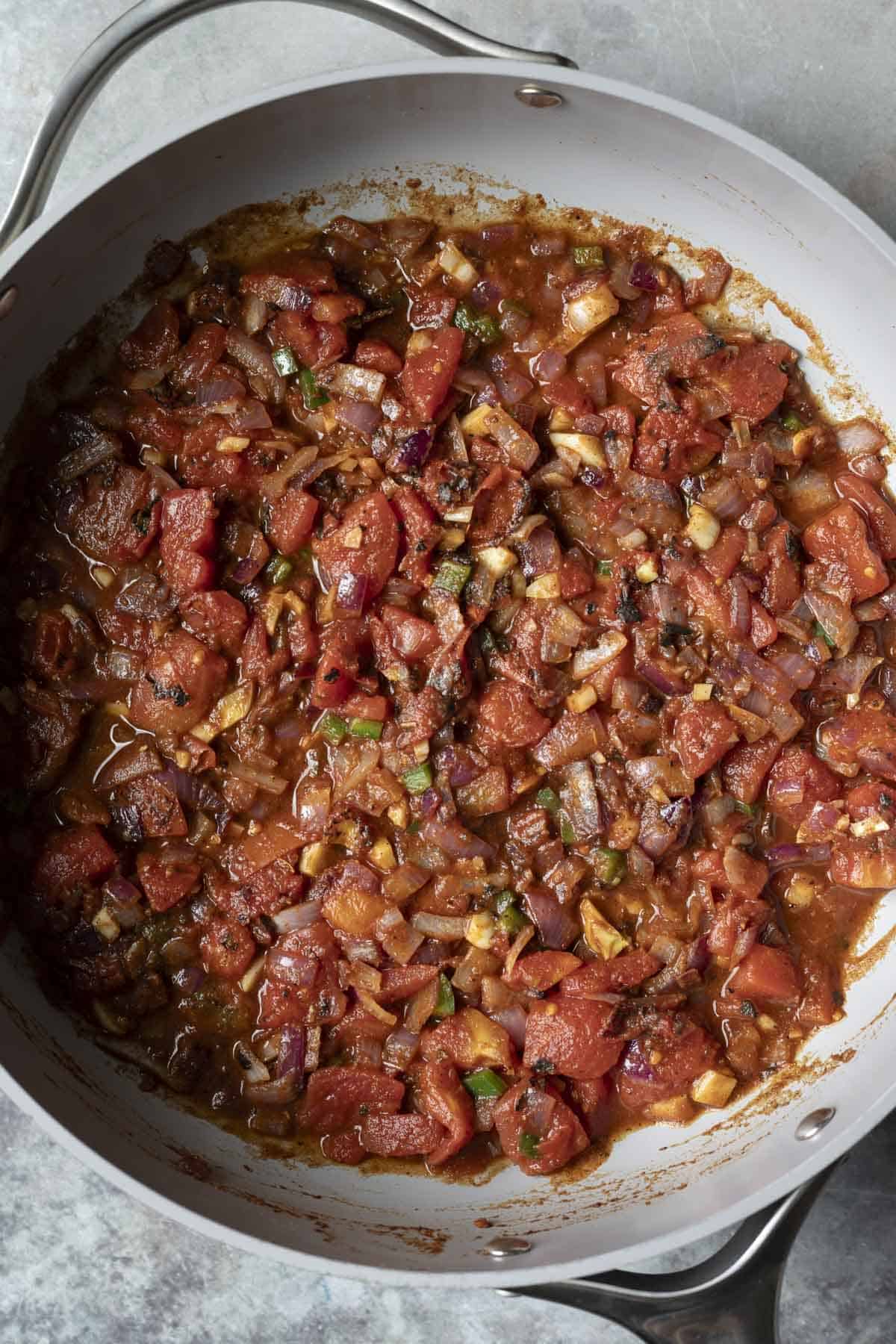 Sauteed onion and spices with diced tomatoes.