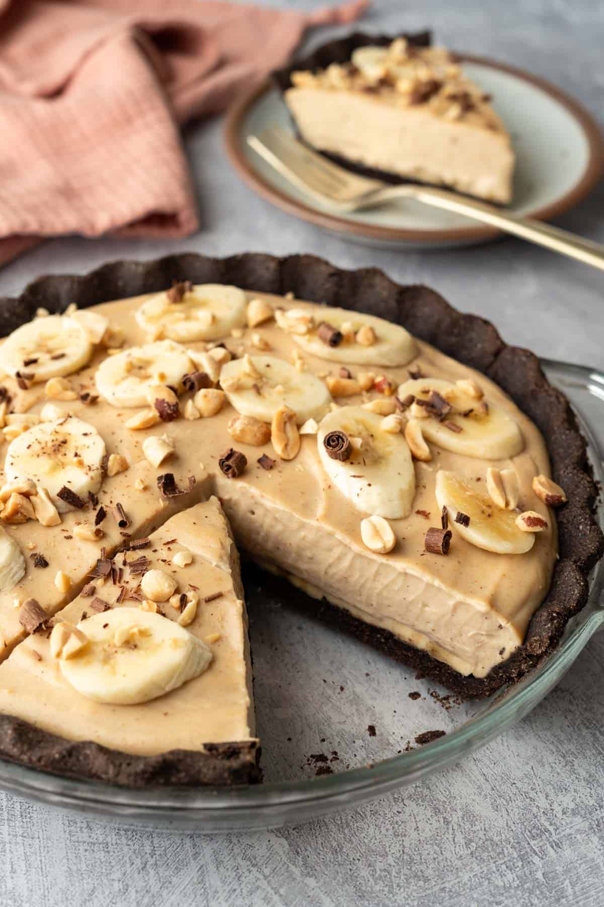 A vegan peanut butter pie in the baked chocolate pie crust to show texture.