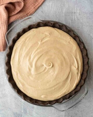 Filling poured into the pie crust and smoothed on top.