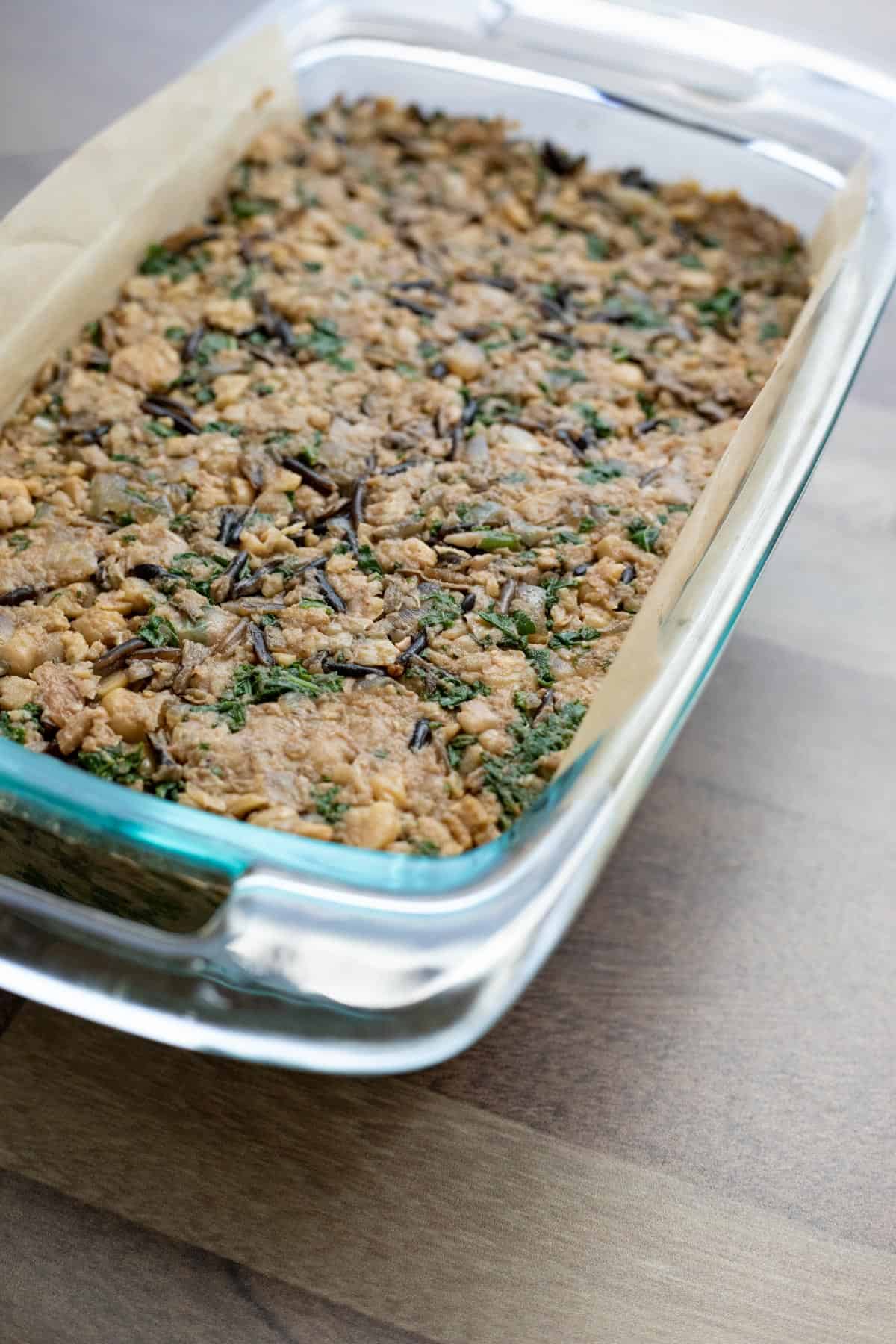 The chickpea veggie loaf mixture packed into a loaf pan.