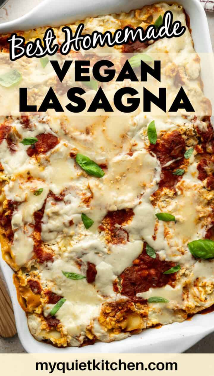 Photo of a whole baked vegan lasagna with the recipe name across the top for saving on Pinterest.