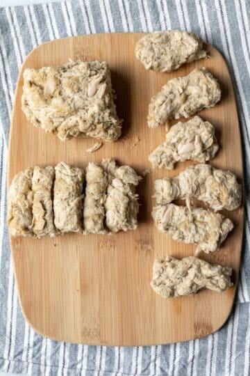 Forming seitan wings on a cutting board.