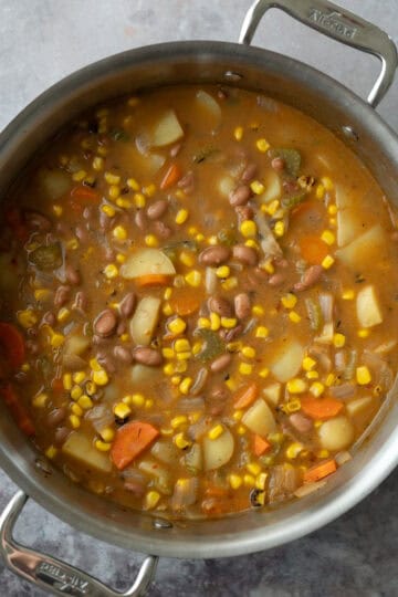 Corn, pinto beans, and water added to the soup pot.