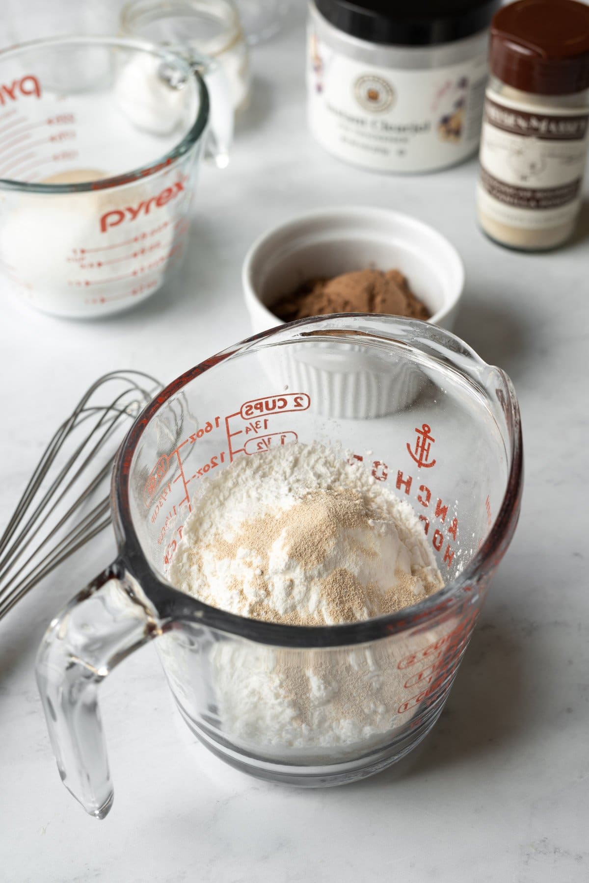 Mixing the dry pudding ingredients together in a large glass measuring cup.
