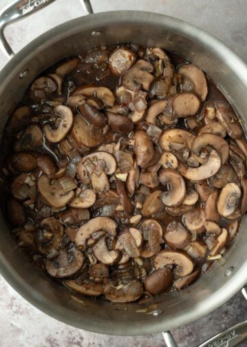 Deglazing the pot with red wine.