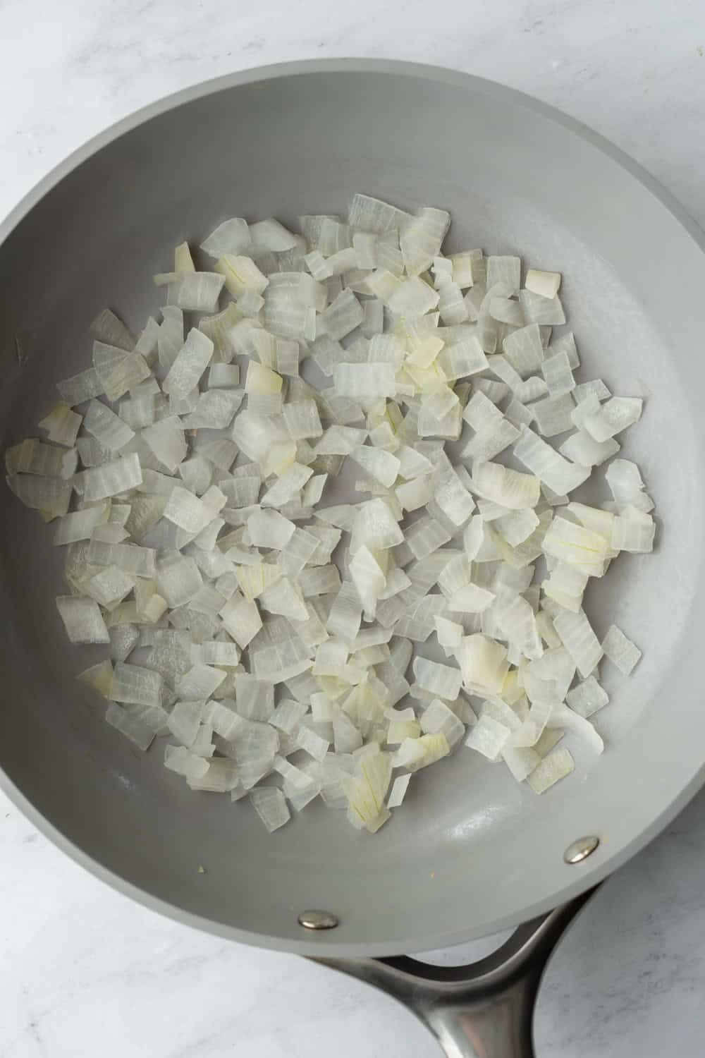 Sauteing chopped onion.