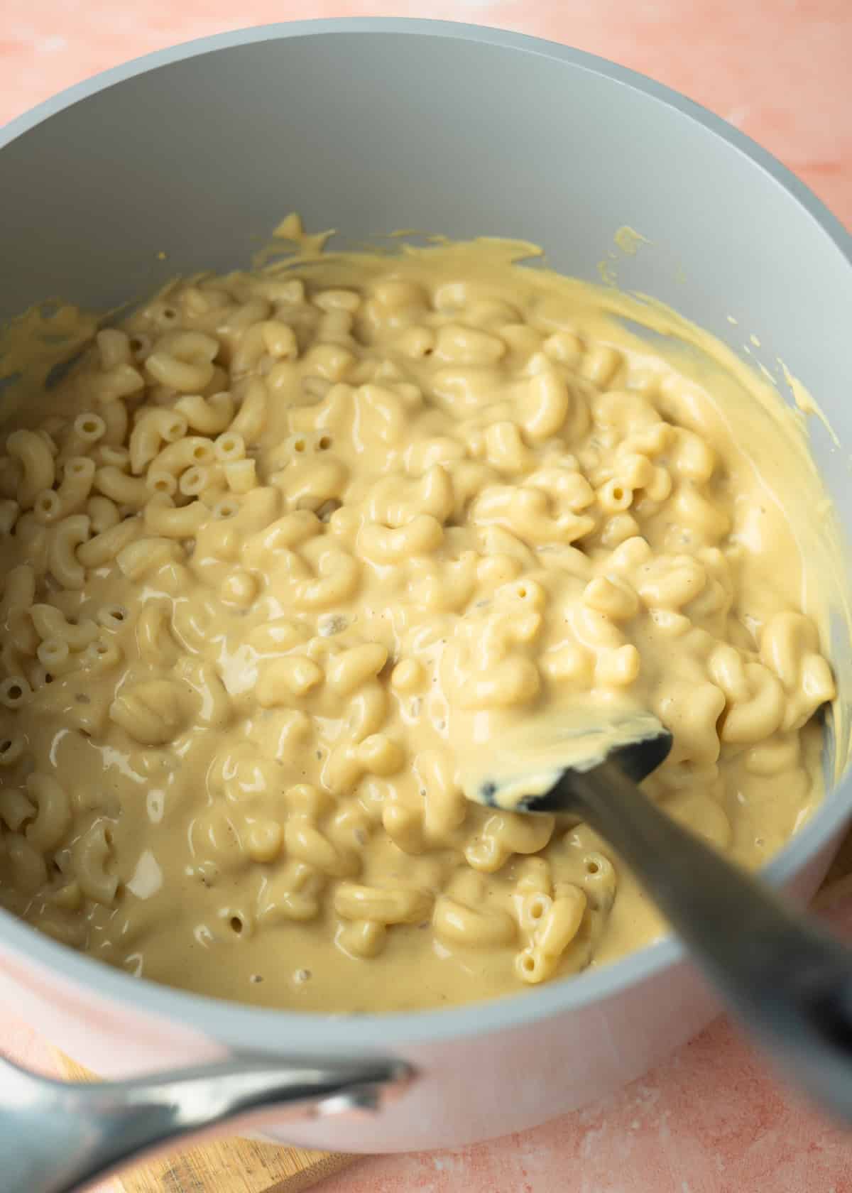 A pot of vegan mac and cheese prepared with homemade cheese powder.