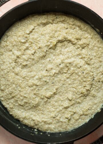 Cheese sauce stirred into the quinoa in the pan.