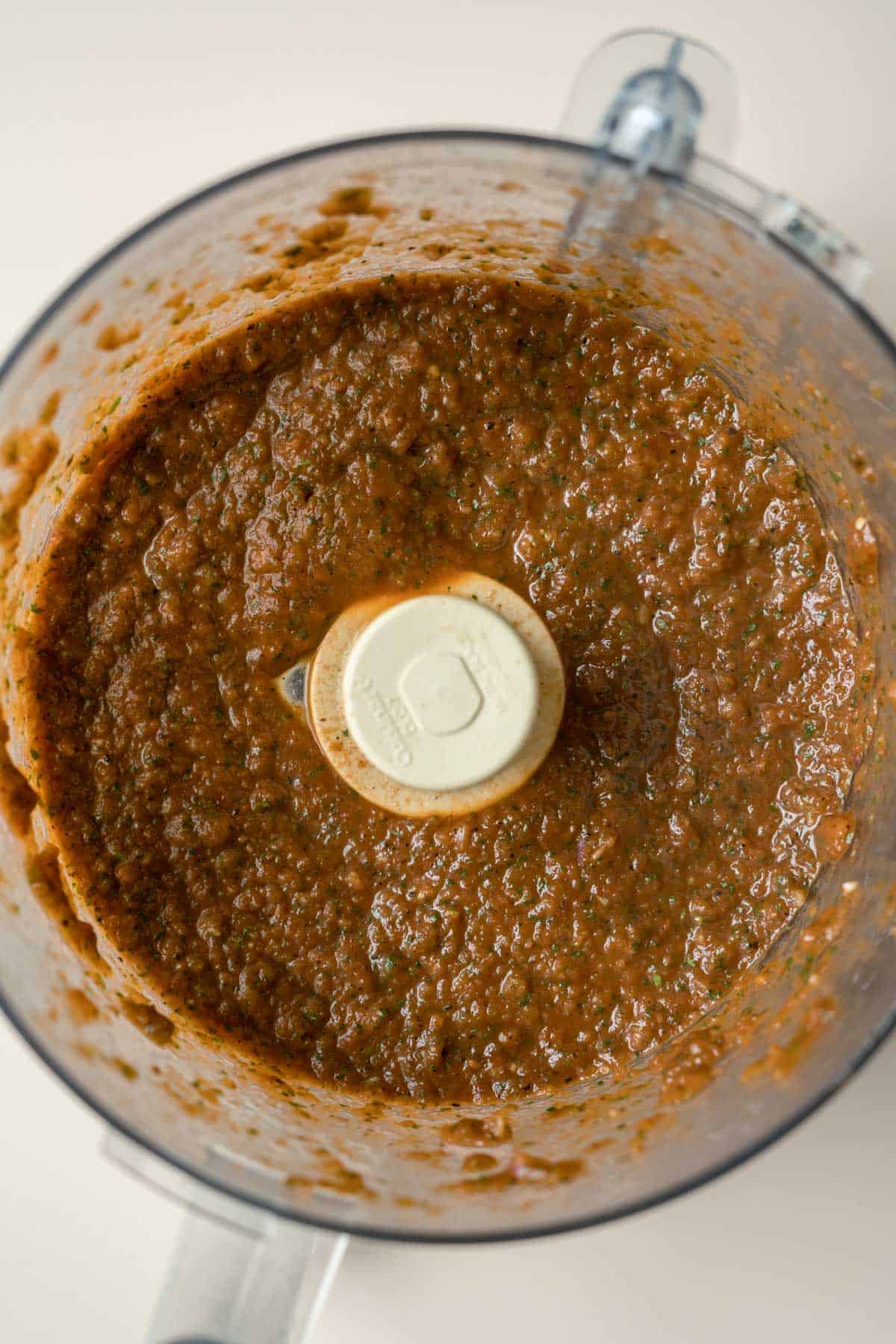 The blended salsa inside the food processor.