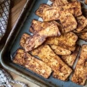 Tofu salami on a baking sheet.