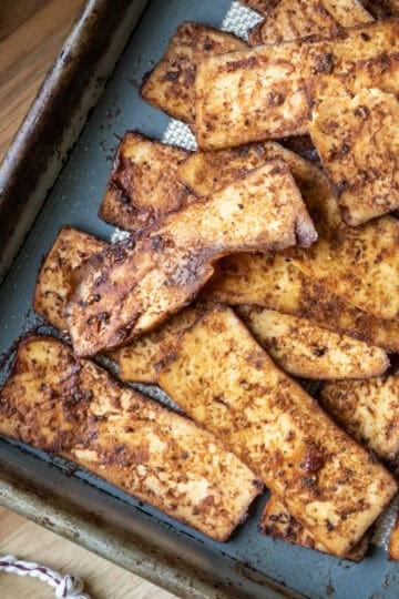 Tofu salami on a baking sheet.