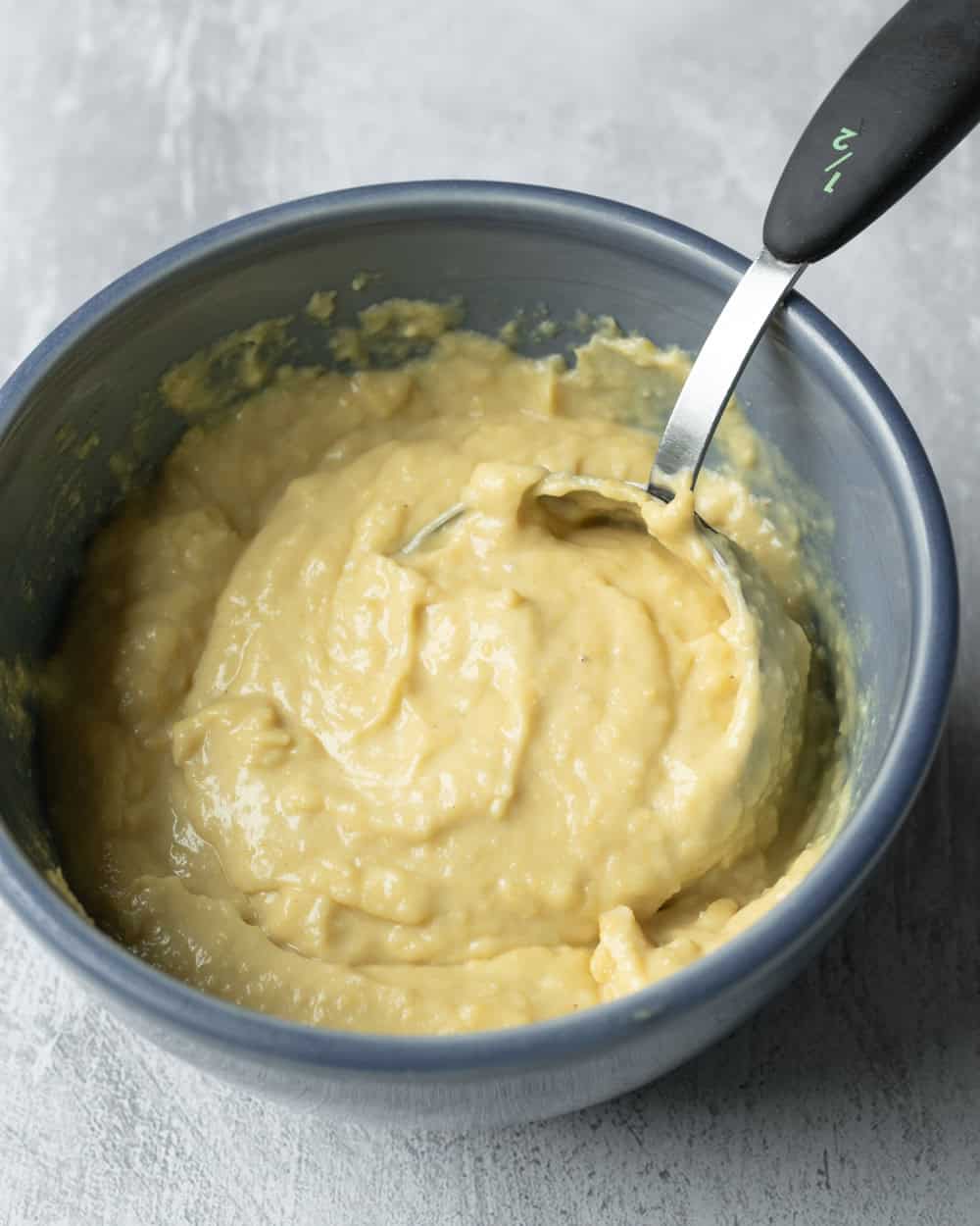 Thick simmered corn ice cream base that includes cornmeal.