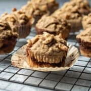 Muffins with cinnamon swirl and walnuts on top.
