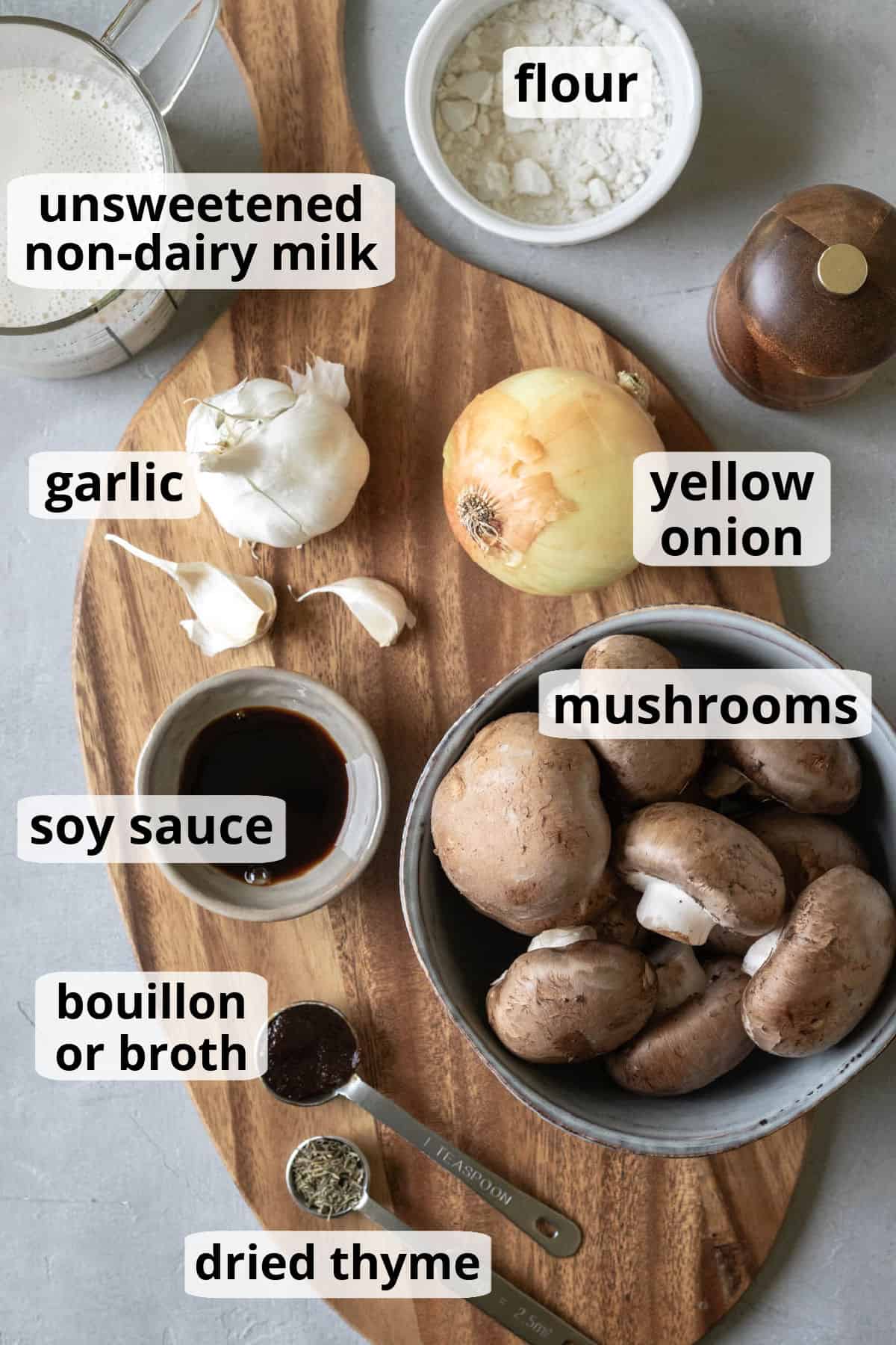 All of the ingredients needed to make vegan mushroom gravy spread on a wood board.