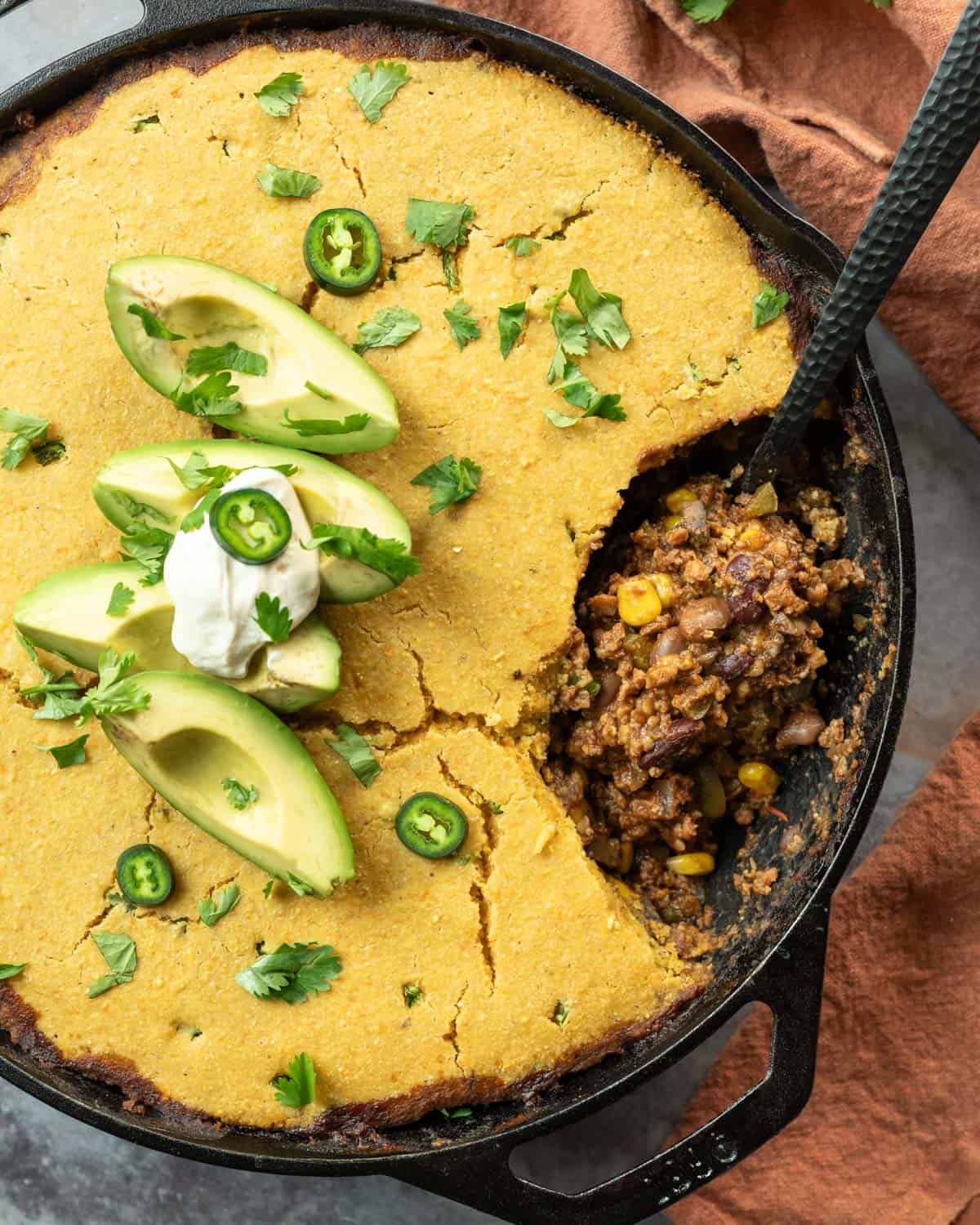 Overhead view of skillet chili cornbread casserole fresh from the oven.