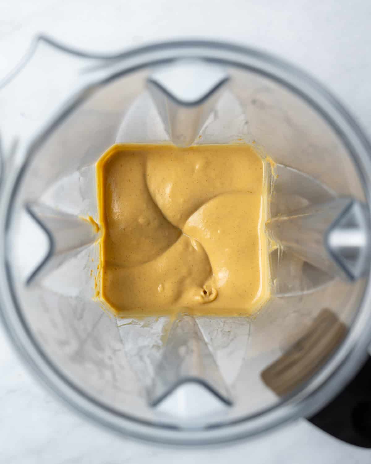 Creamy whipped pumpkin and tofu in a blender.